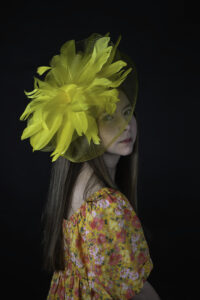 Portrait in flower dress and flower hat taken by Whimsy Photo Studio, a professional photographer in Broome County, NY